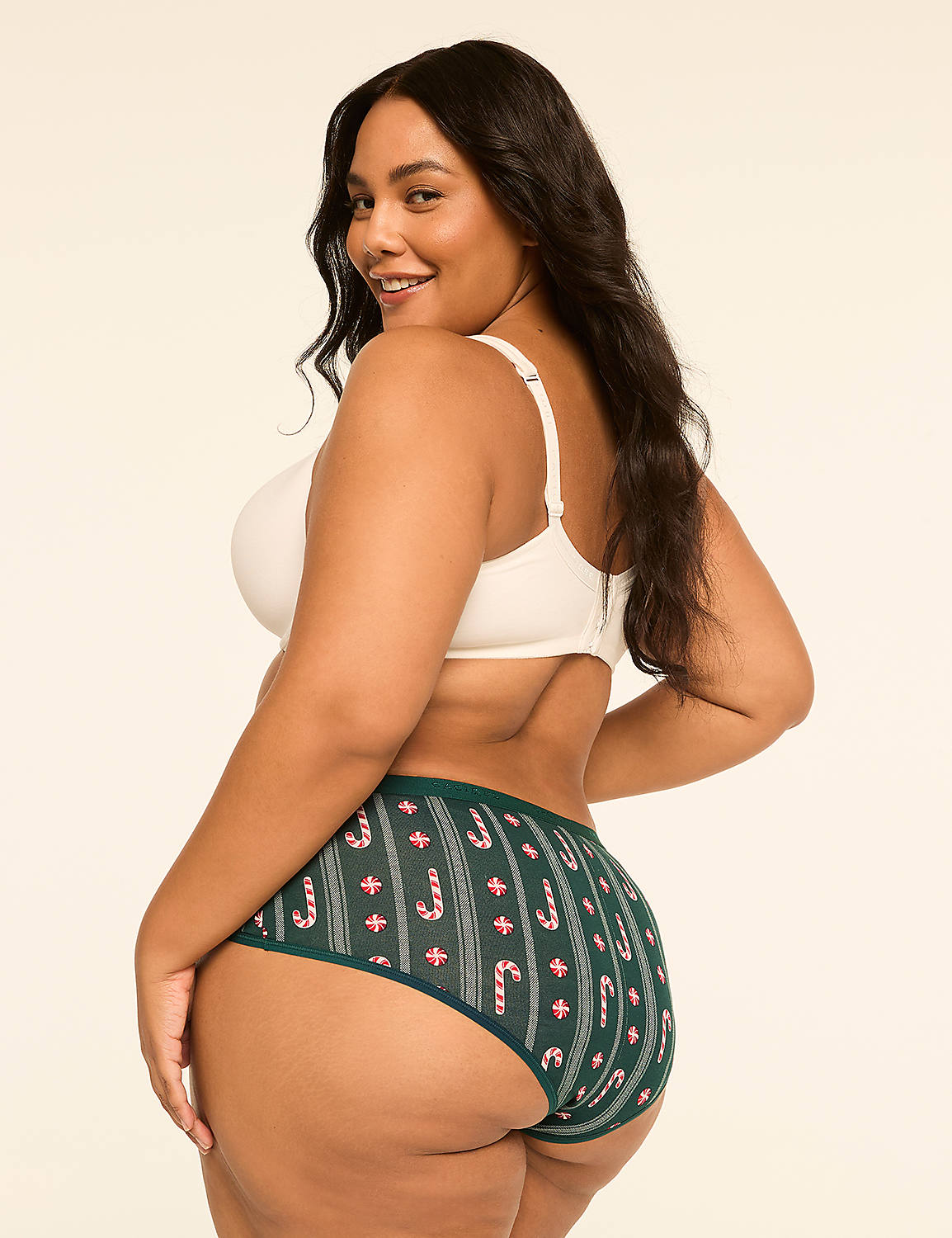 A woman in a white bra and green candy cane patterned underwear poses against a plain, light background. Product Image 2