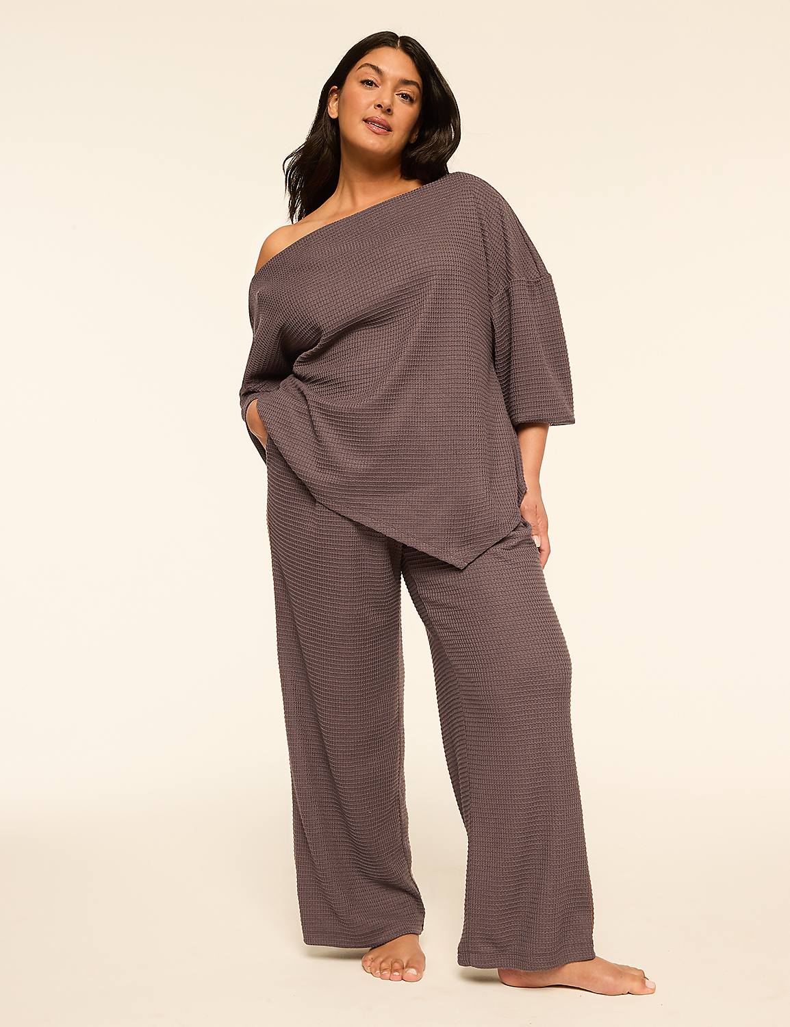 A woman in a gray loungewear set stands with her hand in her pocket against a plain, light-colored background. Product Image 3