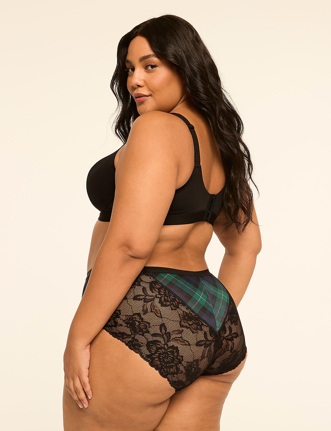 A plus-size woman in black lingerie with plaid accents poses against a plain, light background. Product Image 2