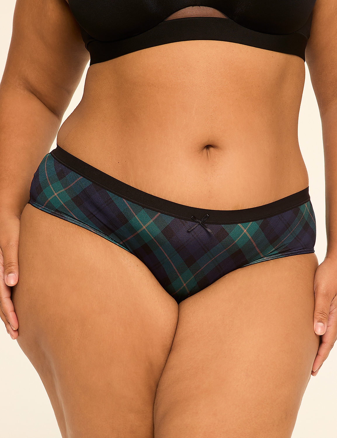 A woman's torso is shown from the waist down, wearing plaid underwear and a black bra, against a plain background. Product Image 1