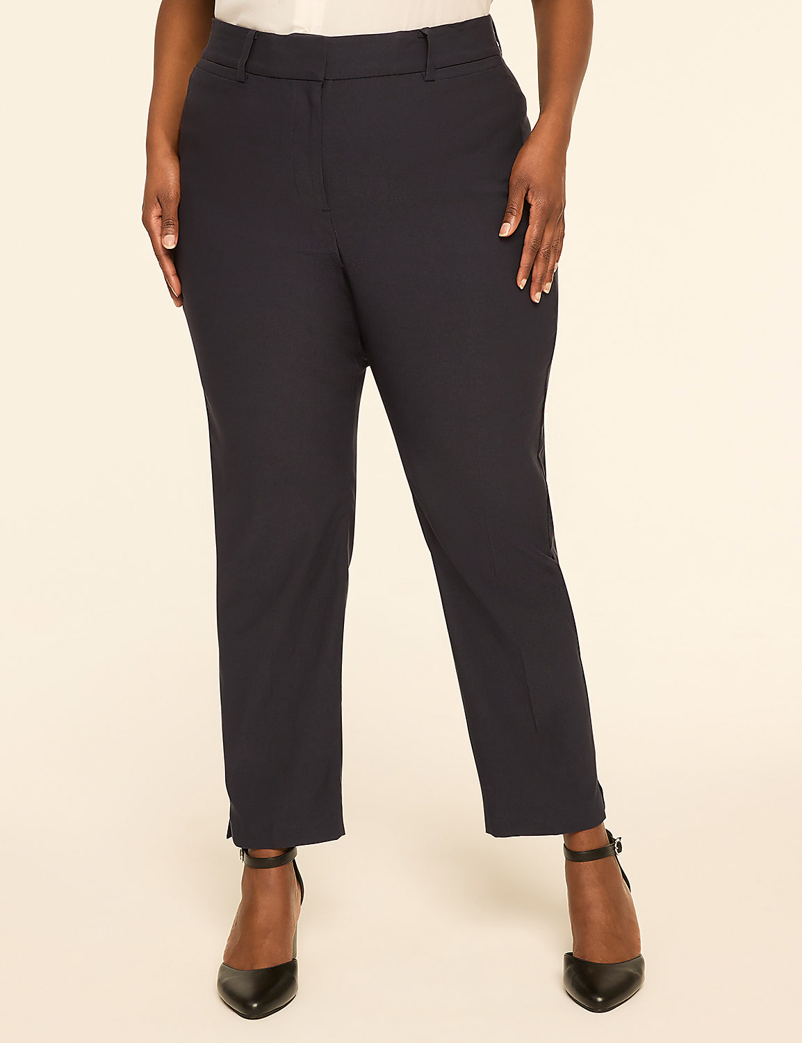 A person stands in dark dress pants and black heels against a plain, light-colored background. Product Image 1