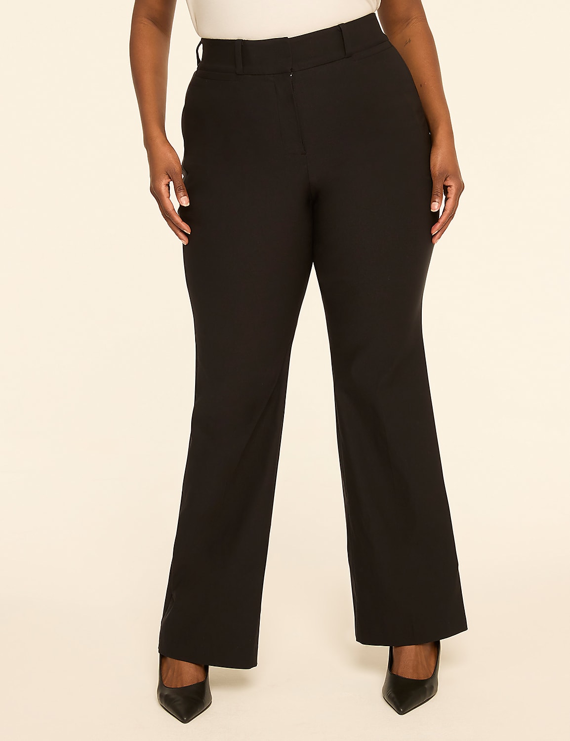 A person stands in black dress pants and heels against a plain, light-colored background. Product Image 1
