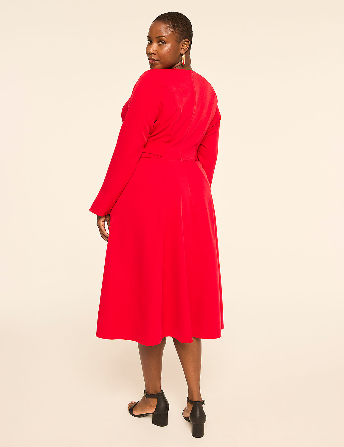 A woman in a red dress stands against a plain, light-colored background. Product Image 2