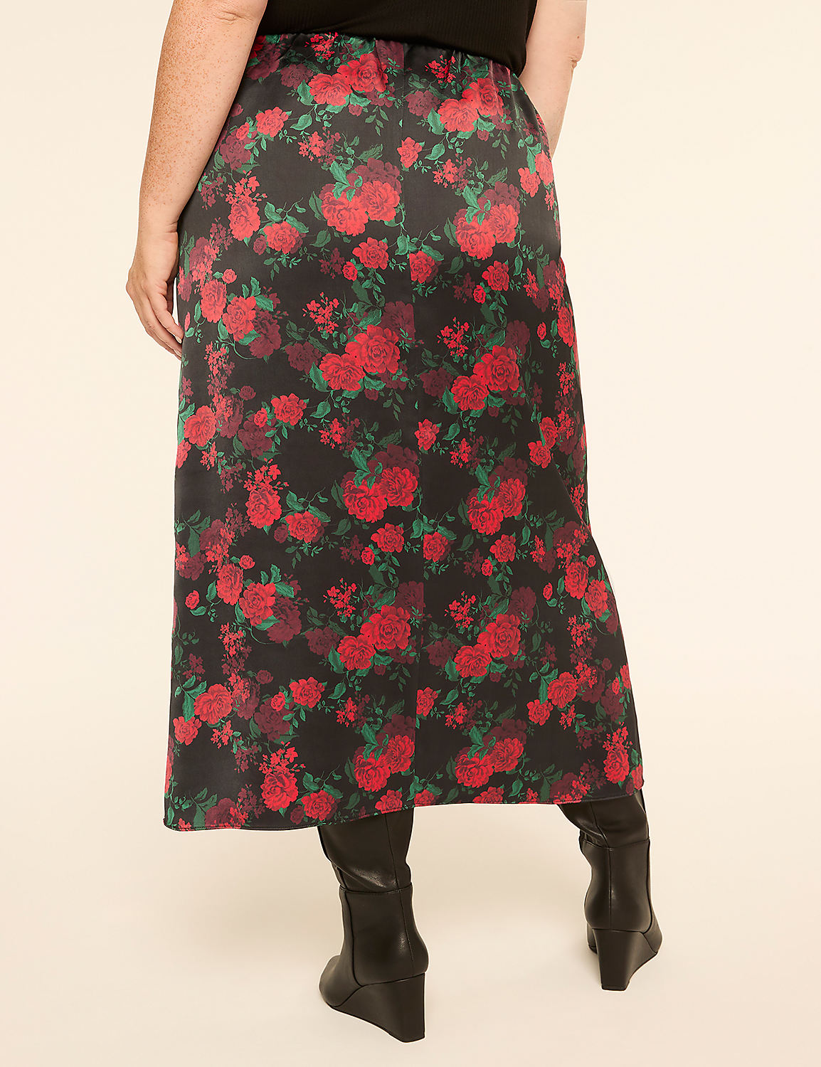A person wearing a floral skirt and black boots stands against a plain, light-colored background. Product Image 2