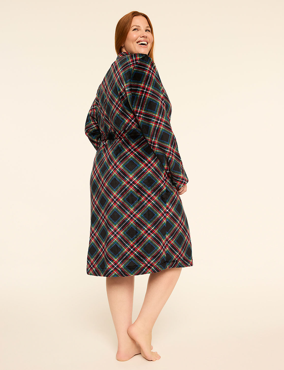A smiling woman in a plaid robe stands barefoot against a plain, light-colored background. Product Image 2