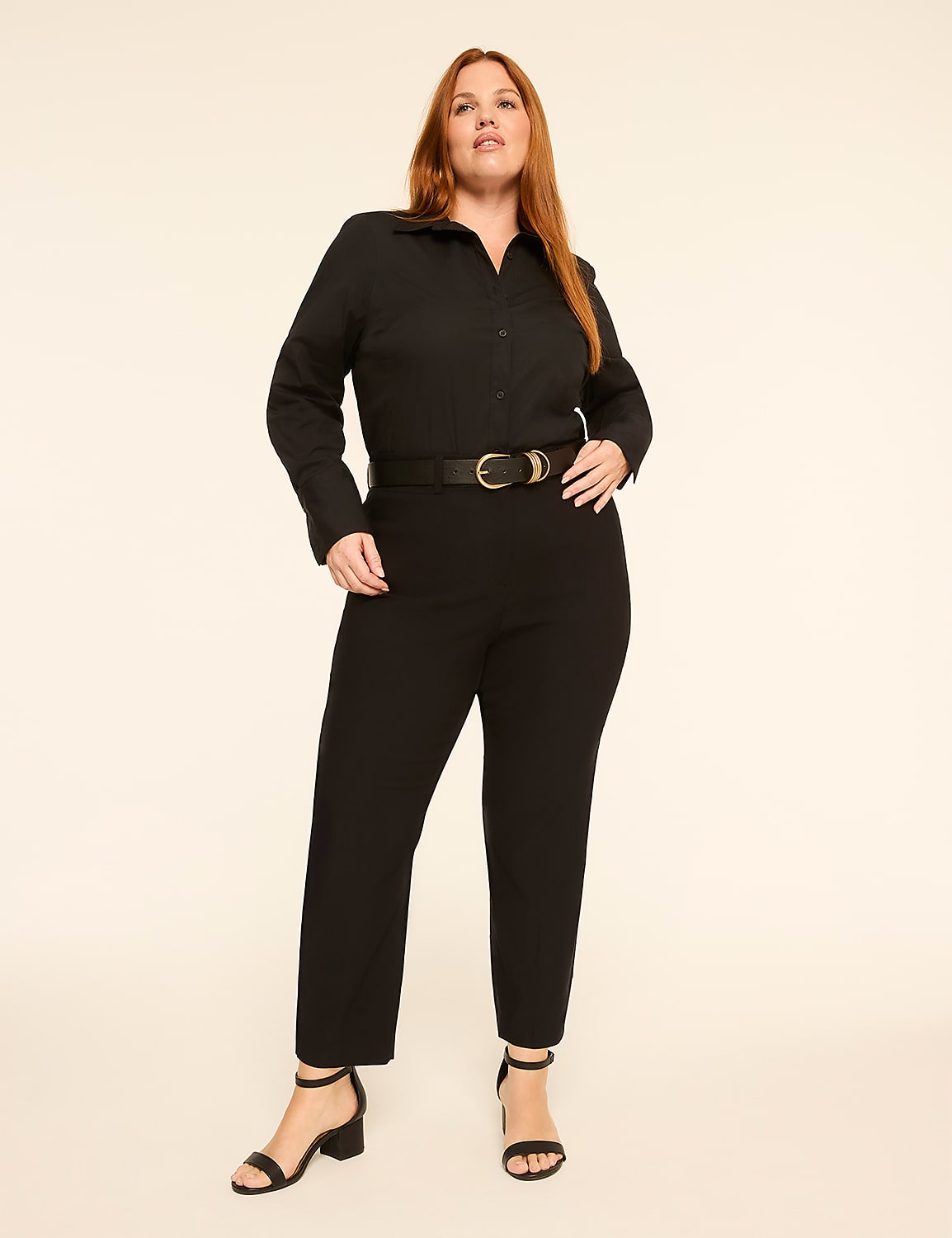 A woman in a black jumpsuit and heels stands against a plain, light-colored background. Product Image 3