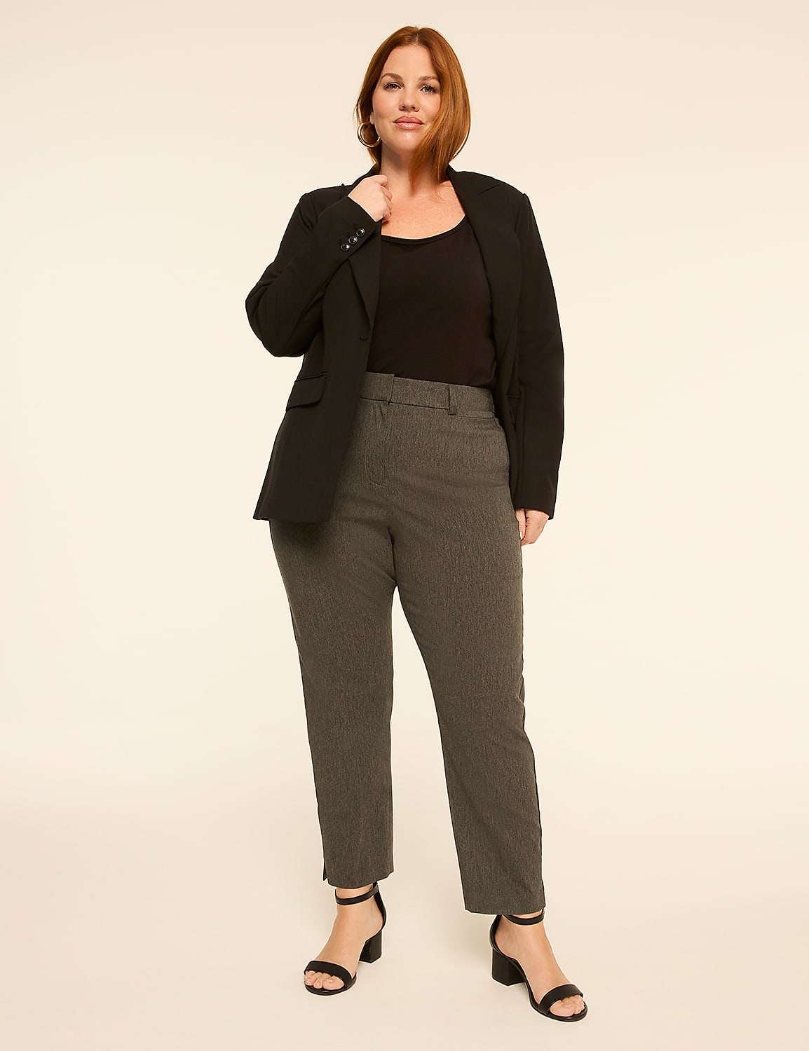 A woman in a black blazer and pinstripe pants stands against a plain, light-colored background. Product Image 3