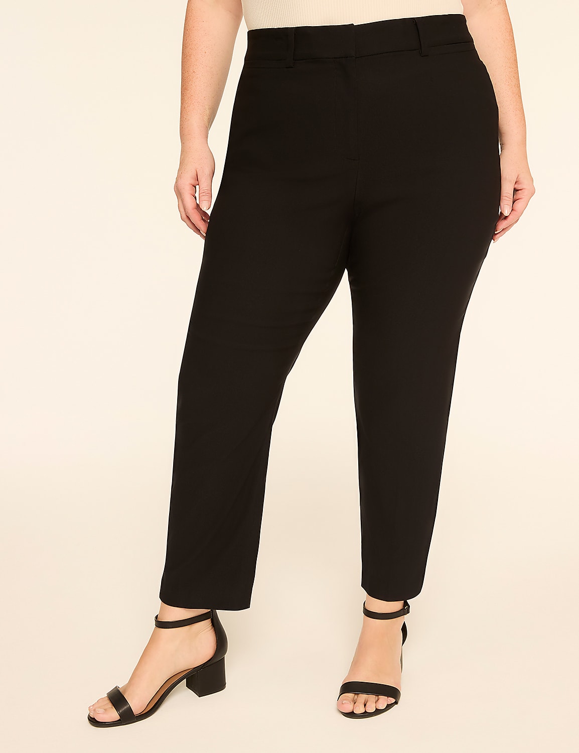 A person wearing black pants and sandals stands against a plain, light-colored background. Product Image 1