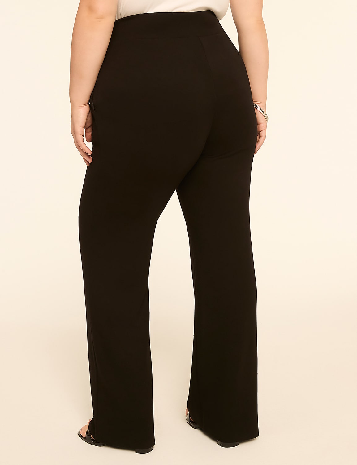 A person wearing black wide-leg pants stands against a plain, light-colored background. Product Image 2