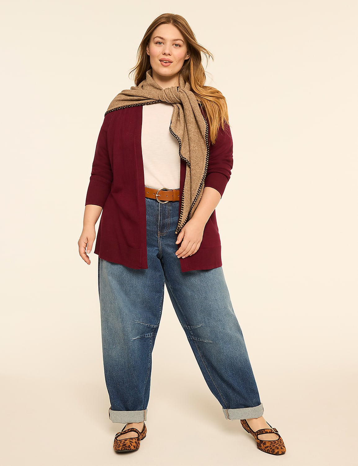 A woman in a maroon cardigan, white t-shirt, and cuffed jeans stands against a plain, light-colored background. Product Image 3