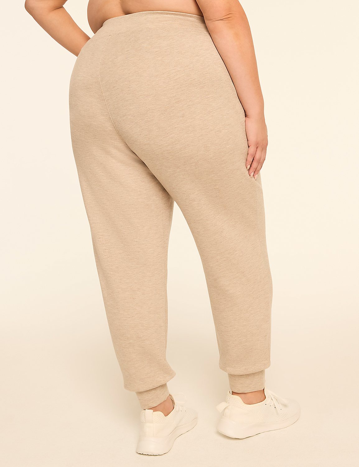 A person wearing beige sweatpants and white sneakers stands against a plain, light-colored background. Product Image 2