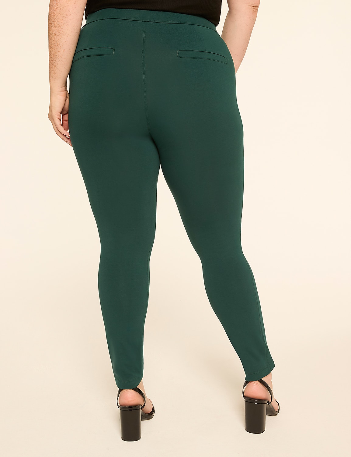 A person wearing dark green pants and black heels stands against a plain beige background. Product Image 2