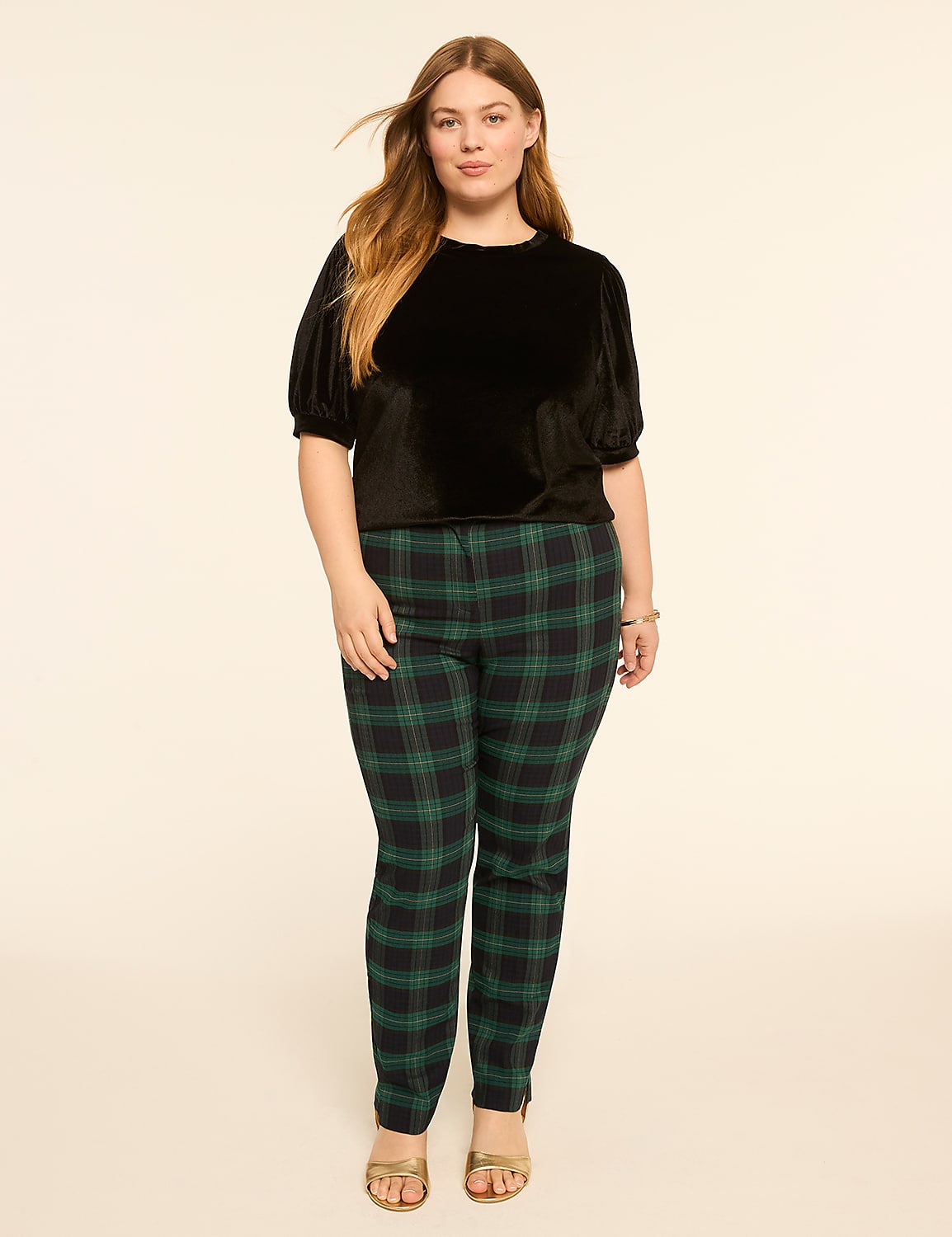 A woman in a black velvet top and green plaid pants stands against a plain cream background. Product Image 3
