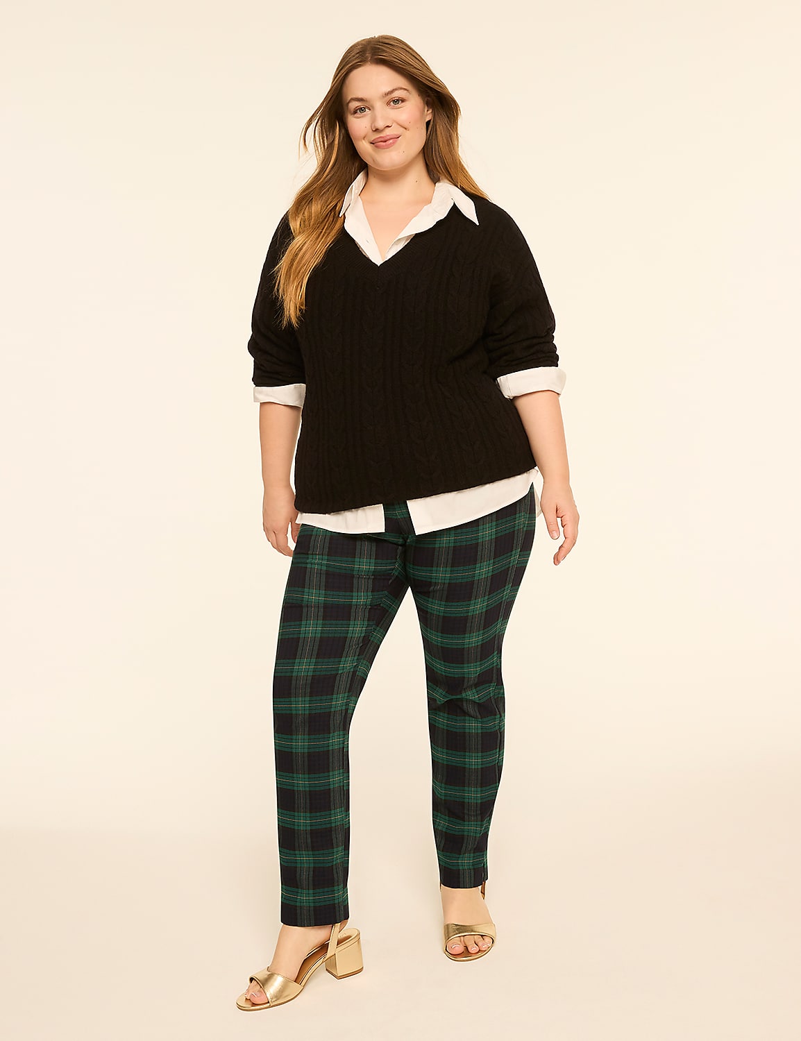A woman in a black sweater, white shirt, and green plaid pants stands against a plain, light-colored background. Product Image 5