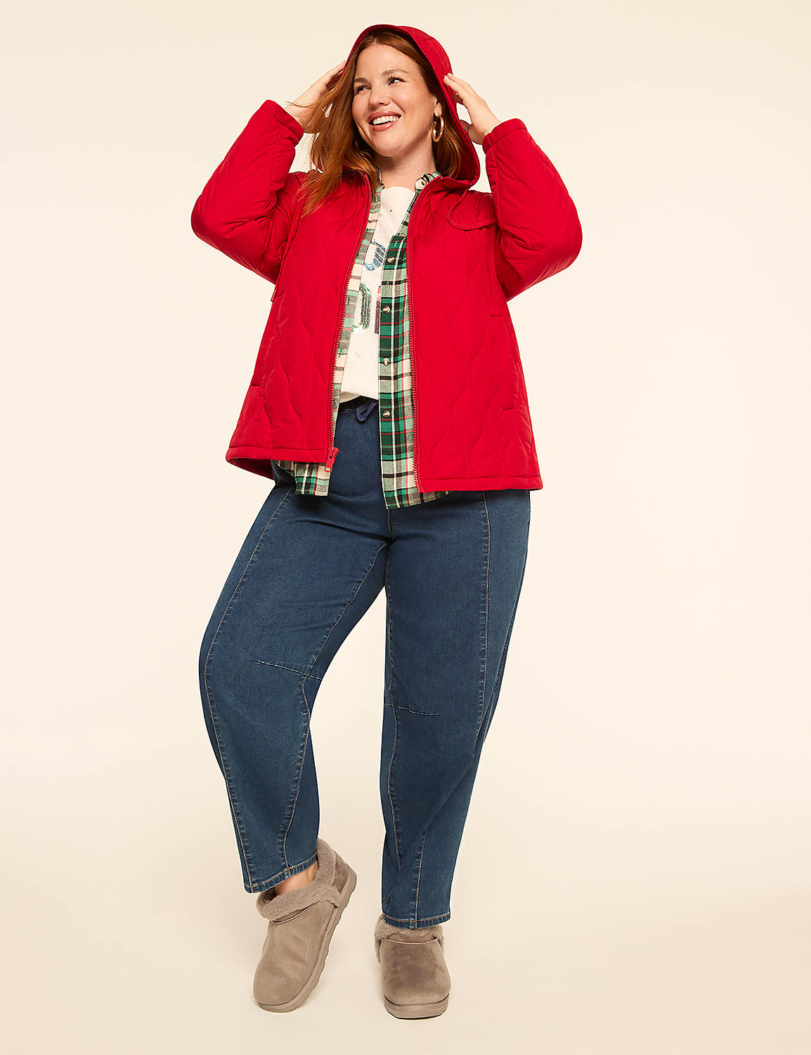 A smiling woman in a red hooded jacket and jeans poses against a plain, light-colored background. Product Image 3