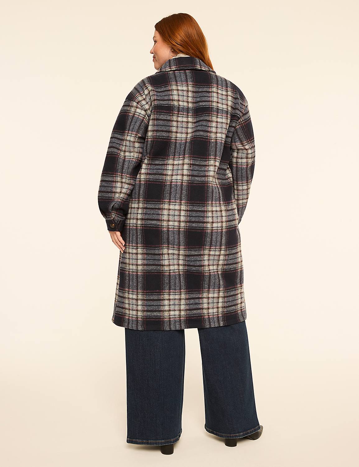 A woman in a plaid coat and wide-leg jeans stands against a plain, light-colored background. Product Image 2