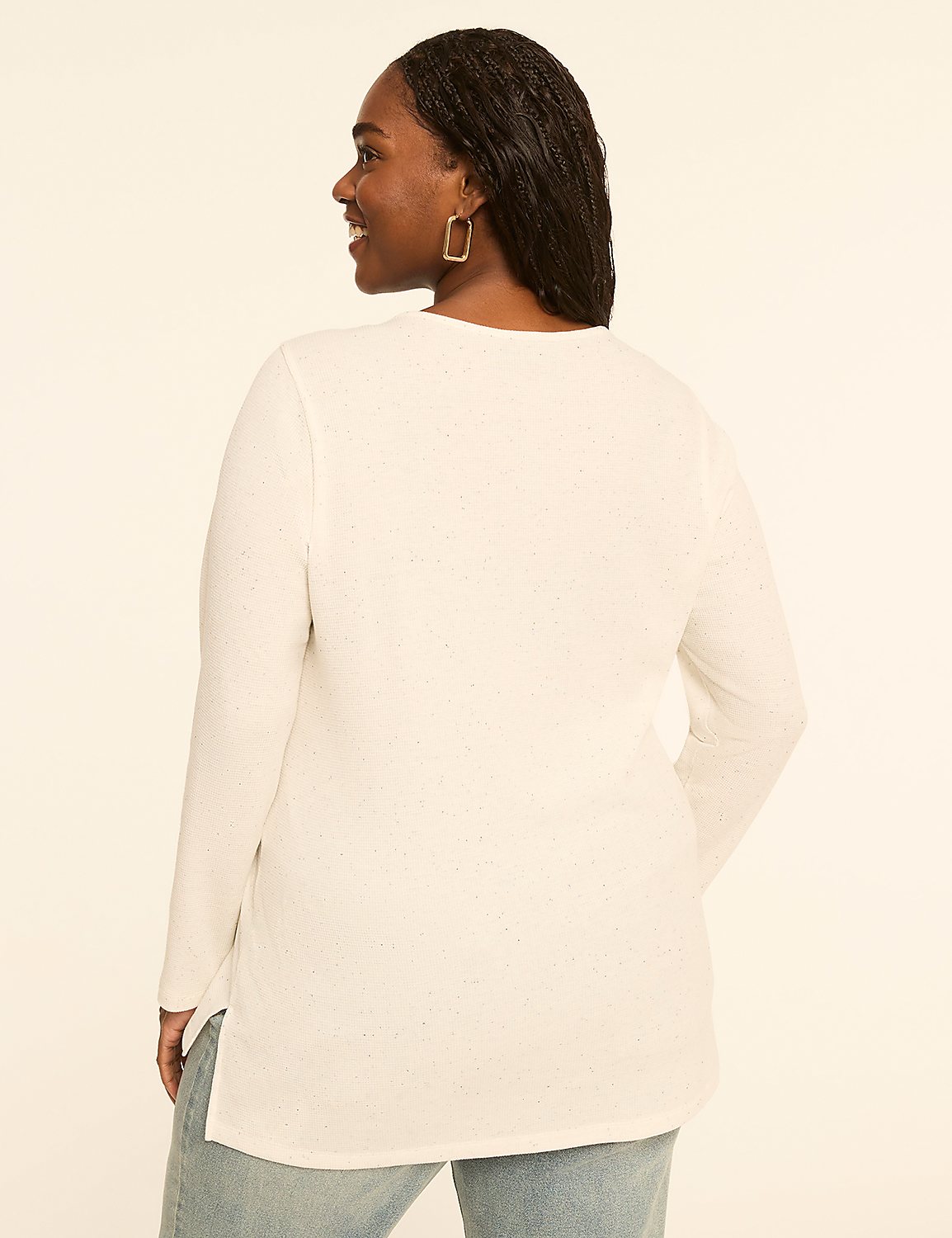 A woman in a white long-sleeved shirt and jeans stands against a plain, light-colored background. Product Image 2
