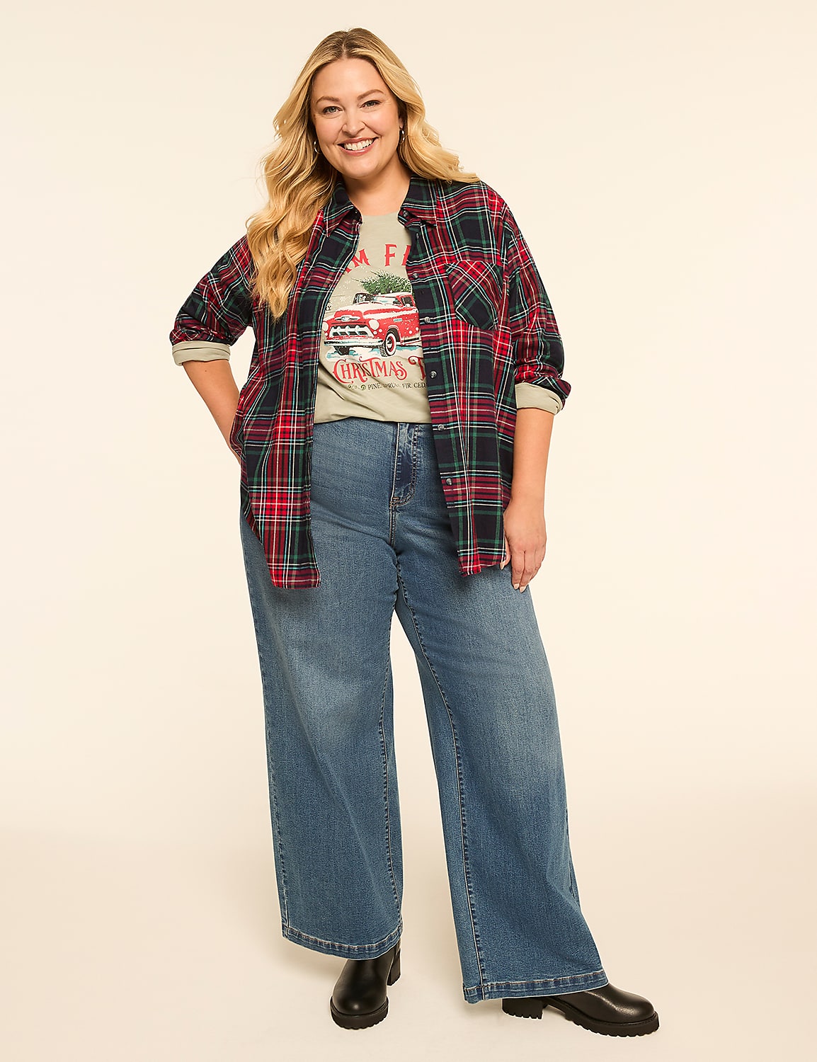 A woman in a plaid shirt and wide-leg jeans stands against a plain, light-colored background. Product Image 3
