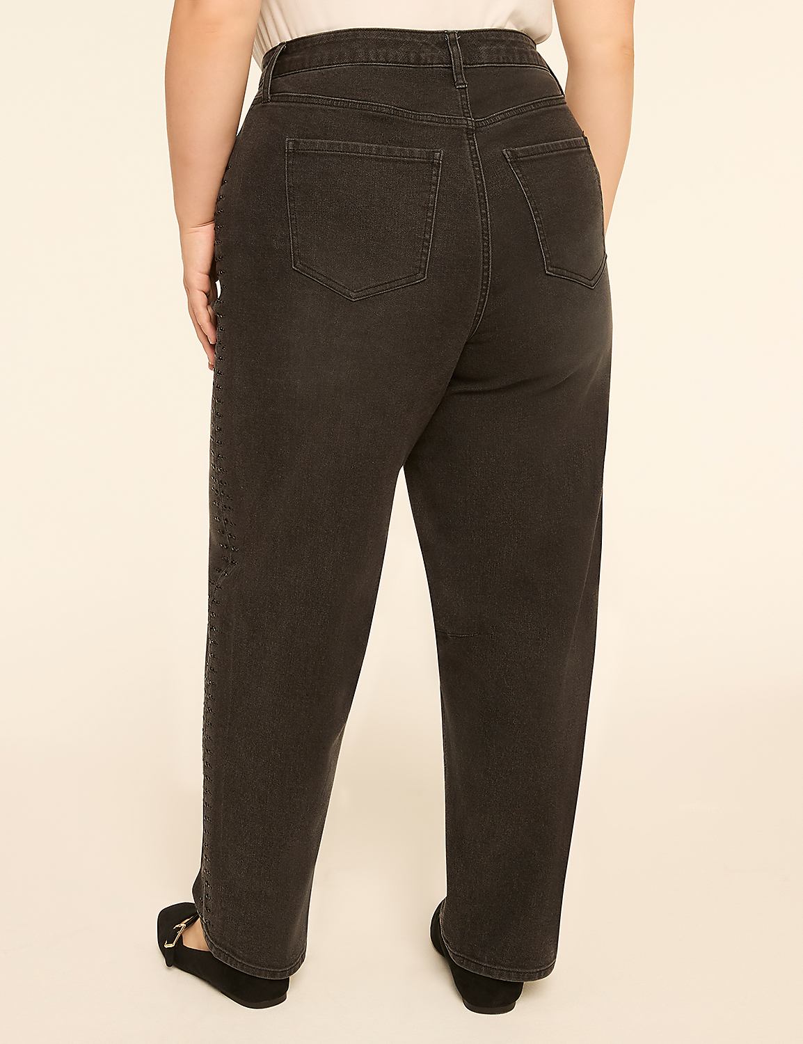 A person wearing dark wash jeans and black flats stands against a plain, light-colored background. Product Image 2