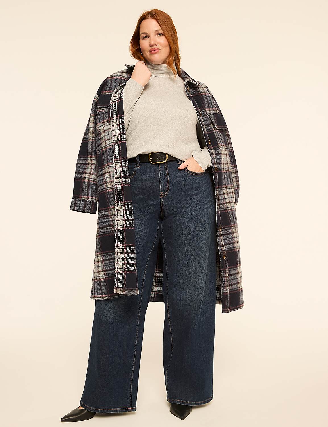 A woman in a plaid coat, turtleneck, and wide-leg jeans stands against a plain, light-colored background. Product Image 3