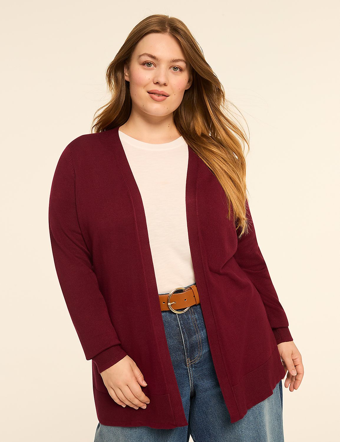 A woman in a burgundy cardigan and jeans stands against a plain, light-colored background. Product Image 1