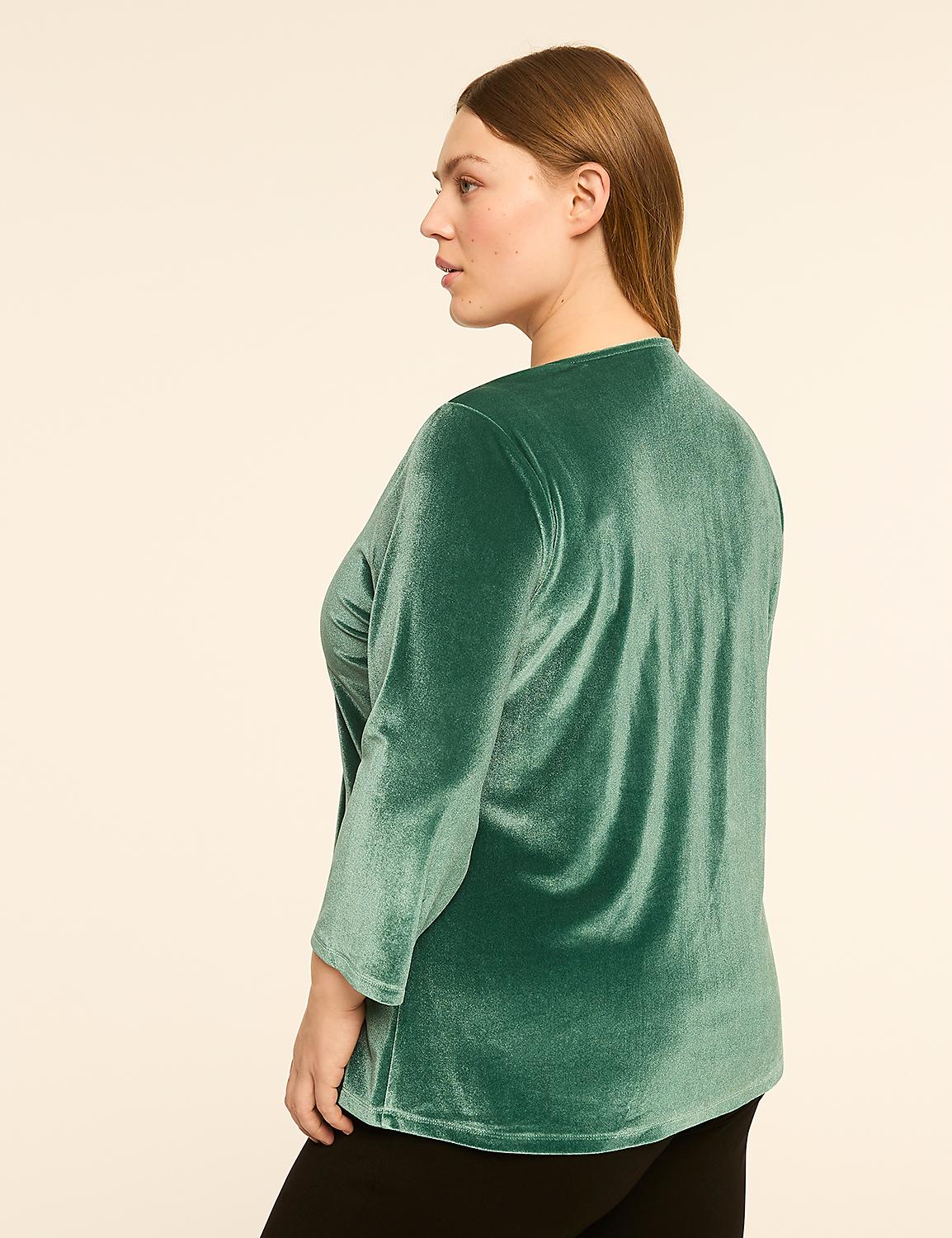 A woman in a green velvet top stands against a plain, light-colored background. Product Image 2