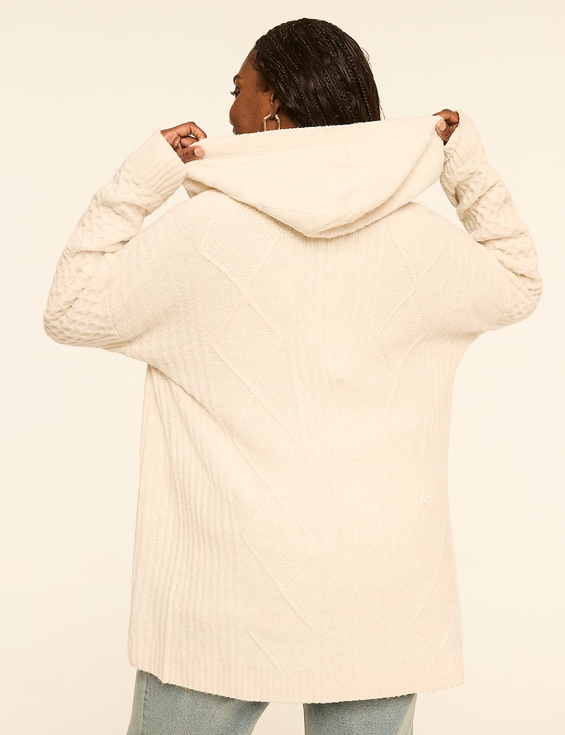 A woman in a cream-colored hooded sweater is shown from the back against a plain, light-colored background. Product Image 2