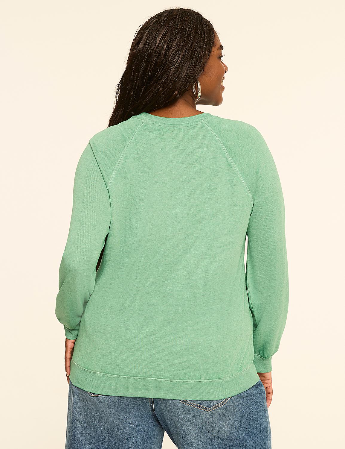 A woman in a green sweatshirt and blue jeans stands against a plain, light-colored background. Product Image 2