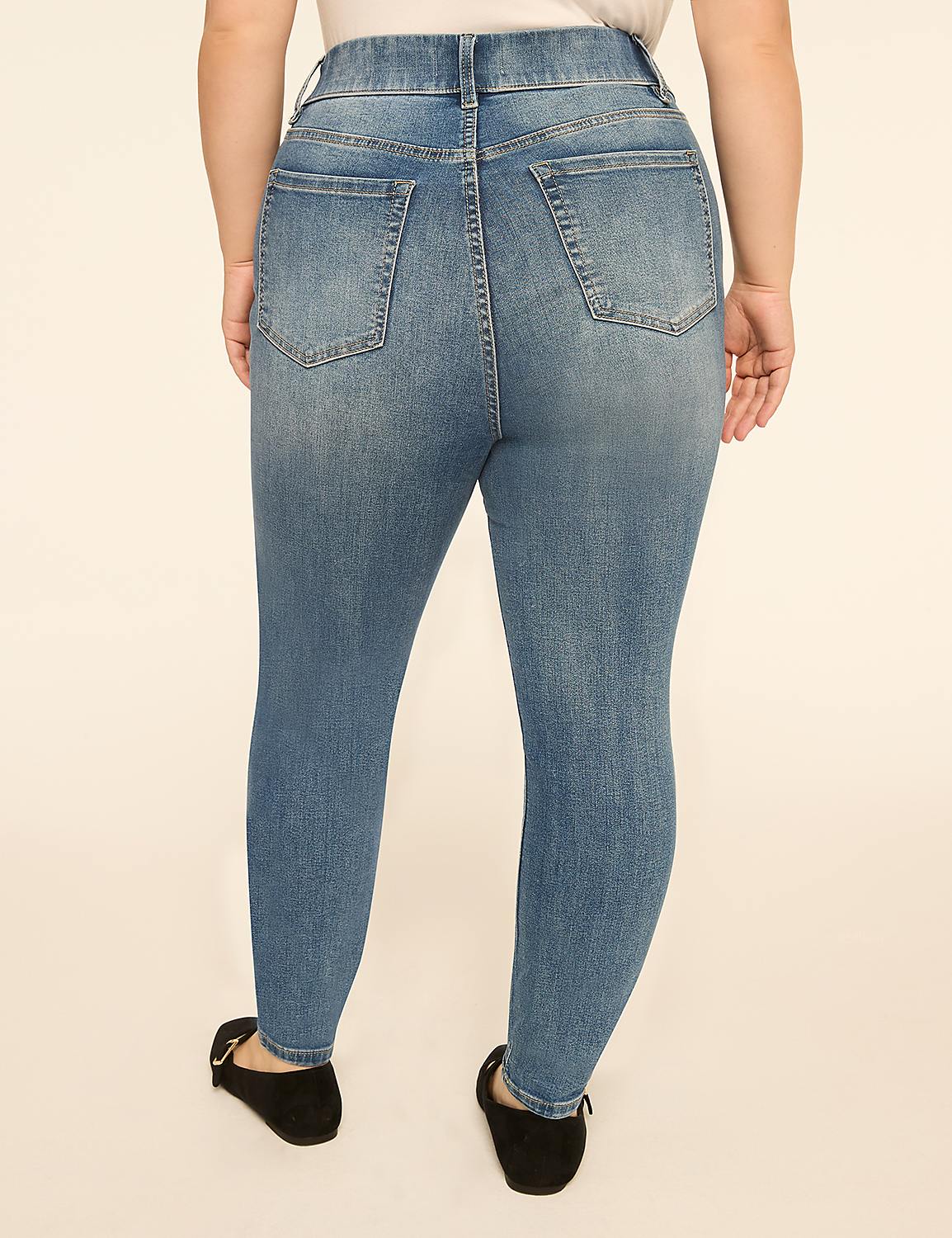 A person wearing blue denim jeans and black flats stands against a plain, light-colored background. Product Image 2