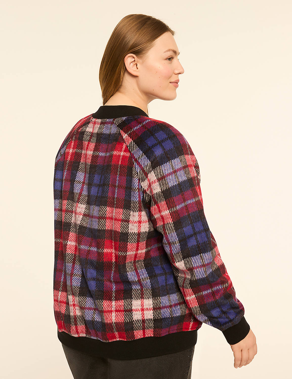 A woman in a plaid bomber jacket is shown from the back against a plain, light-colored background. Product Image 2
