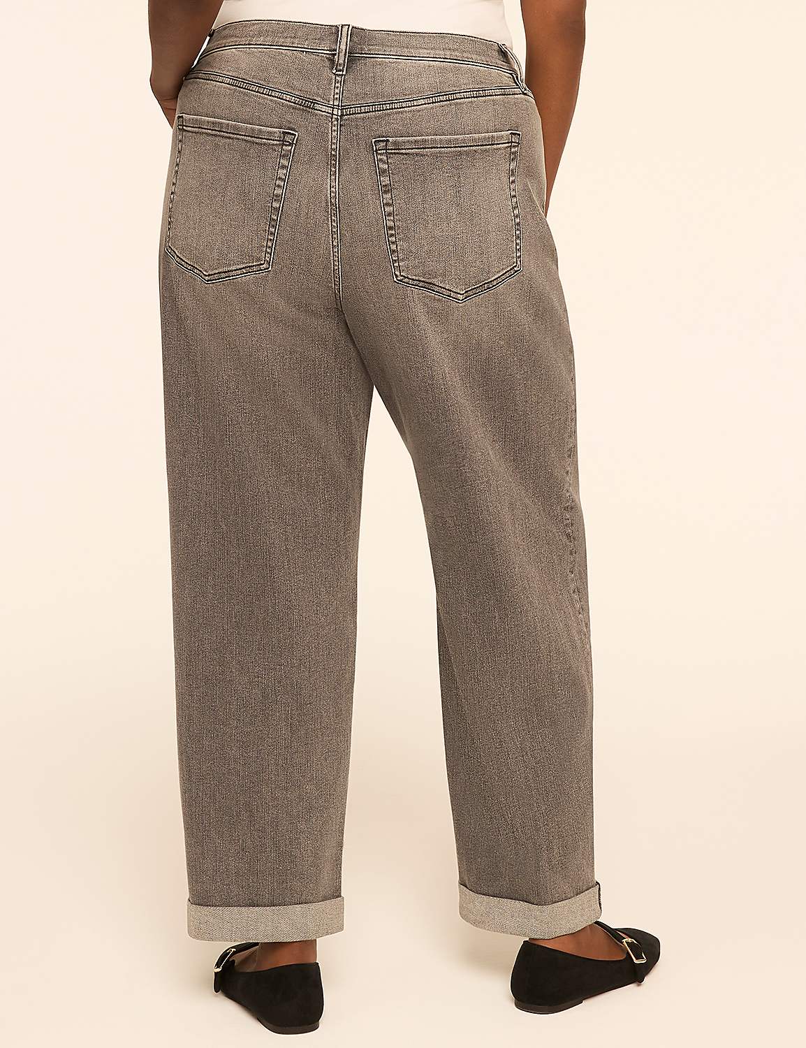 A person wearing cuffed grey jeans and black flats stands against a plain, light-colored background. Product Image 2