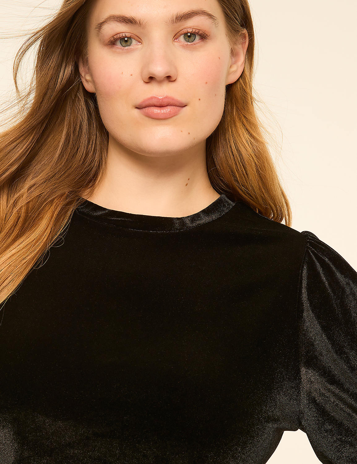 A young woman with long, auburn hair and fair skin wears a black velvet top with puffed sleeves, set against a plain, light-colored background. Product Image 4