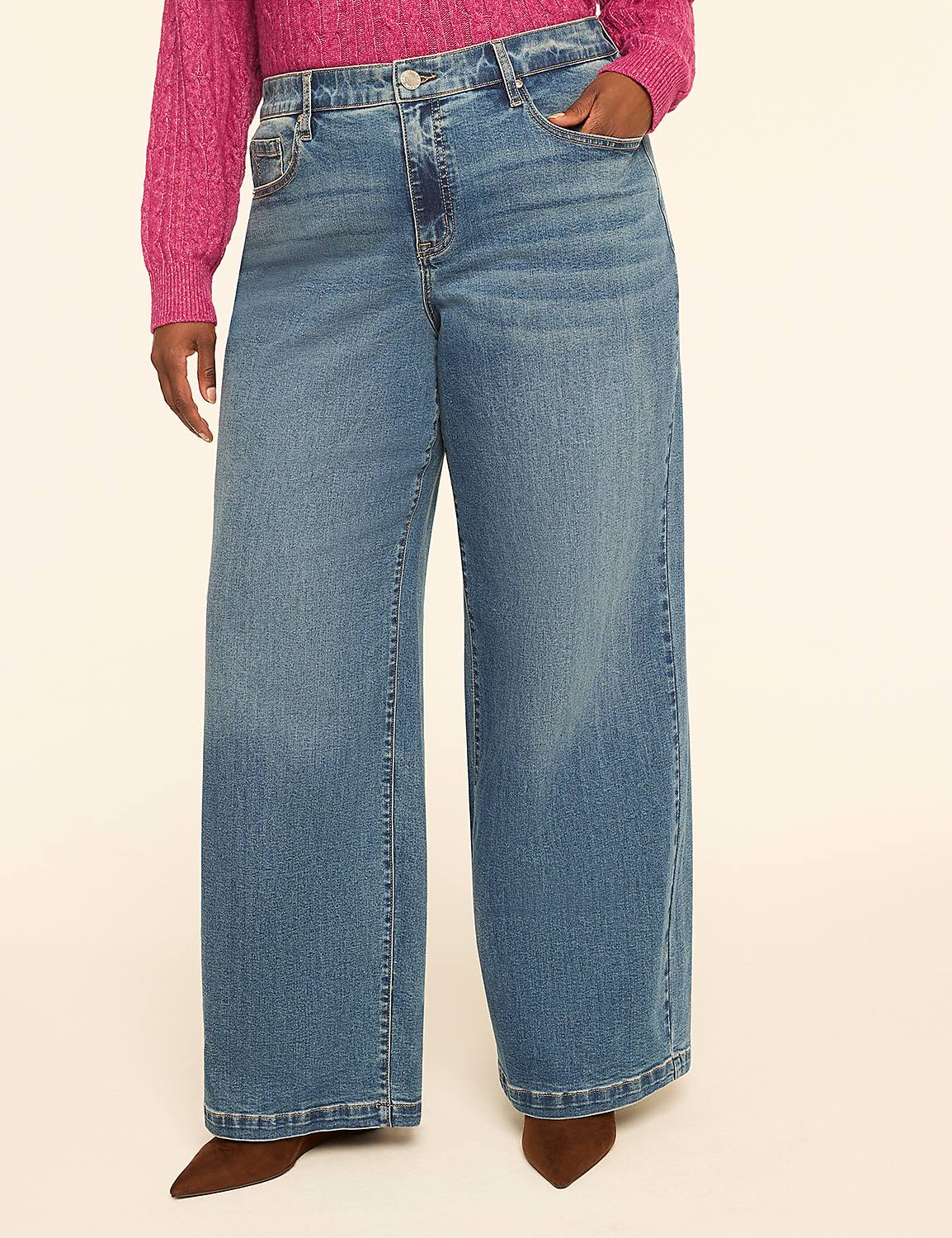 A person wearing wide-leg blue jeans and a pink sweater stands against a plain, light-colored background. Product Image 1