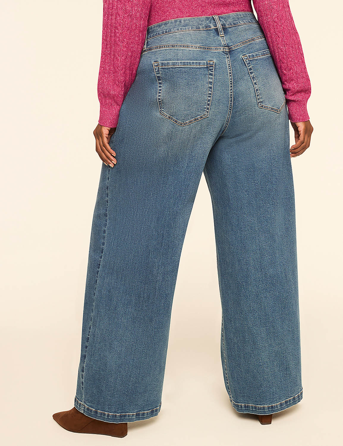 A person wearing wide-leg jeans and a pink sweater stands against a plain, light-colored background. Product Image 2