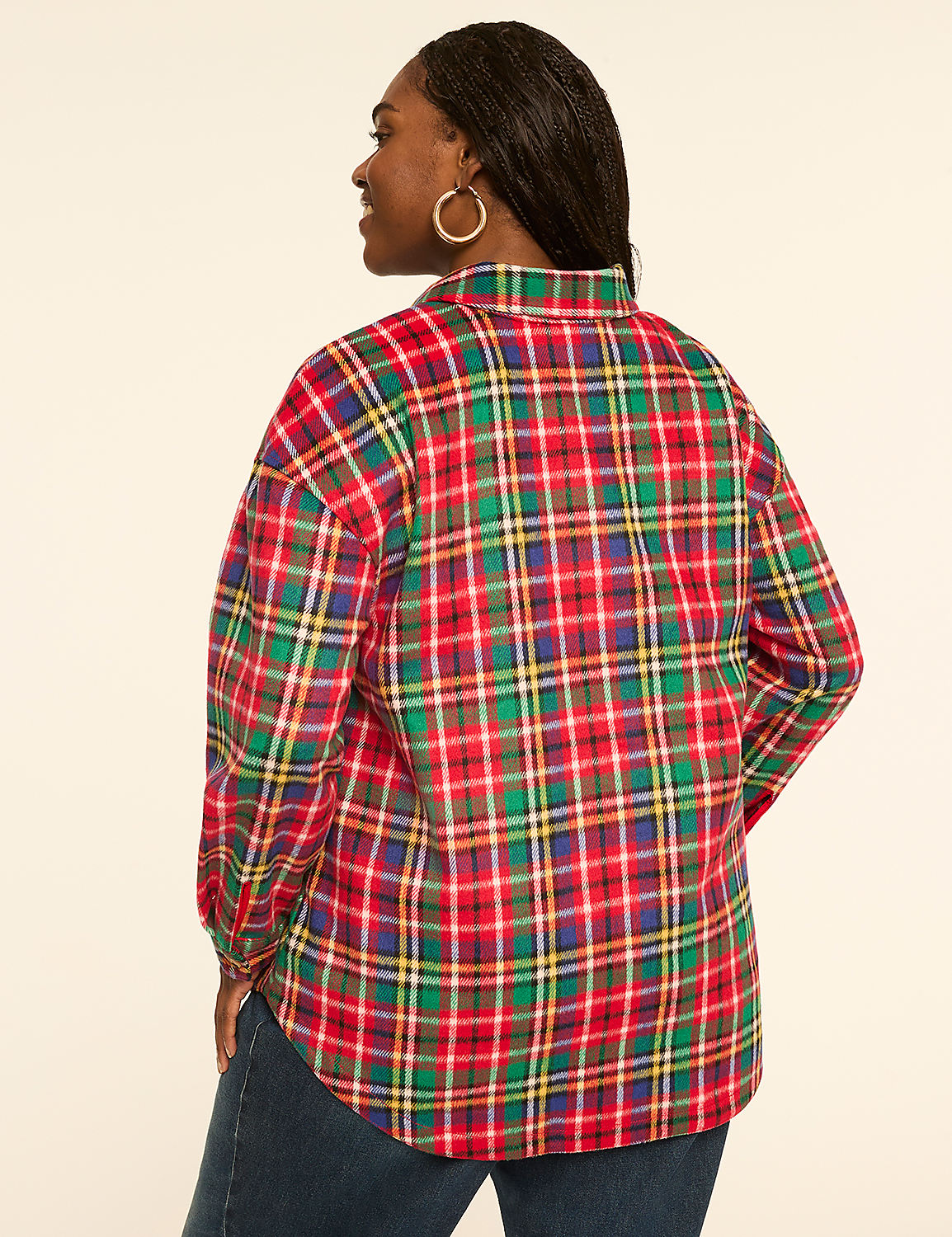 A woman in a red, green, and yellow plaid shirt stands against a plain, light-colored background. Product Image 2