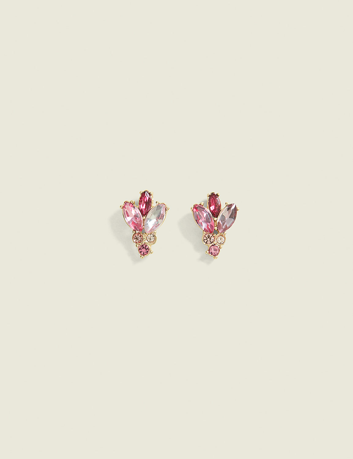 A pair of delicate pink gemstone cluster earrings rests on a pale, textured background. Product Image 1