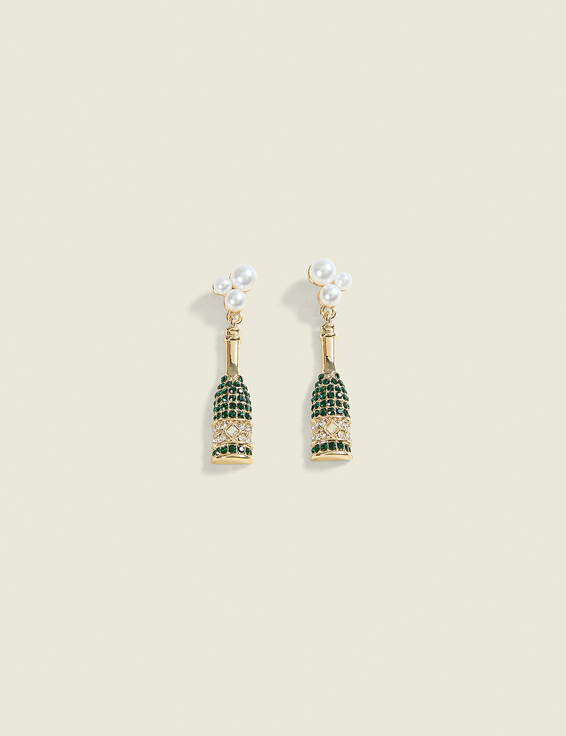 A pair of champagne bottle-shaped earrings with pearl accents dangle against a pale cream background. Product Image 1