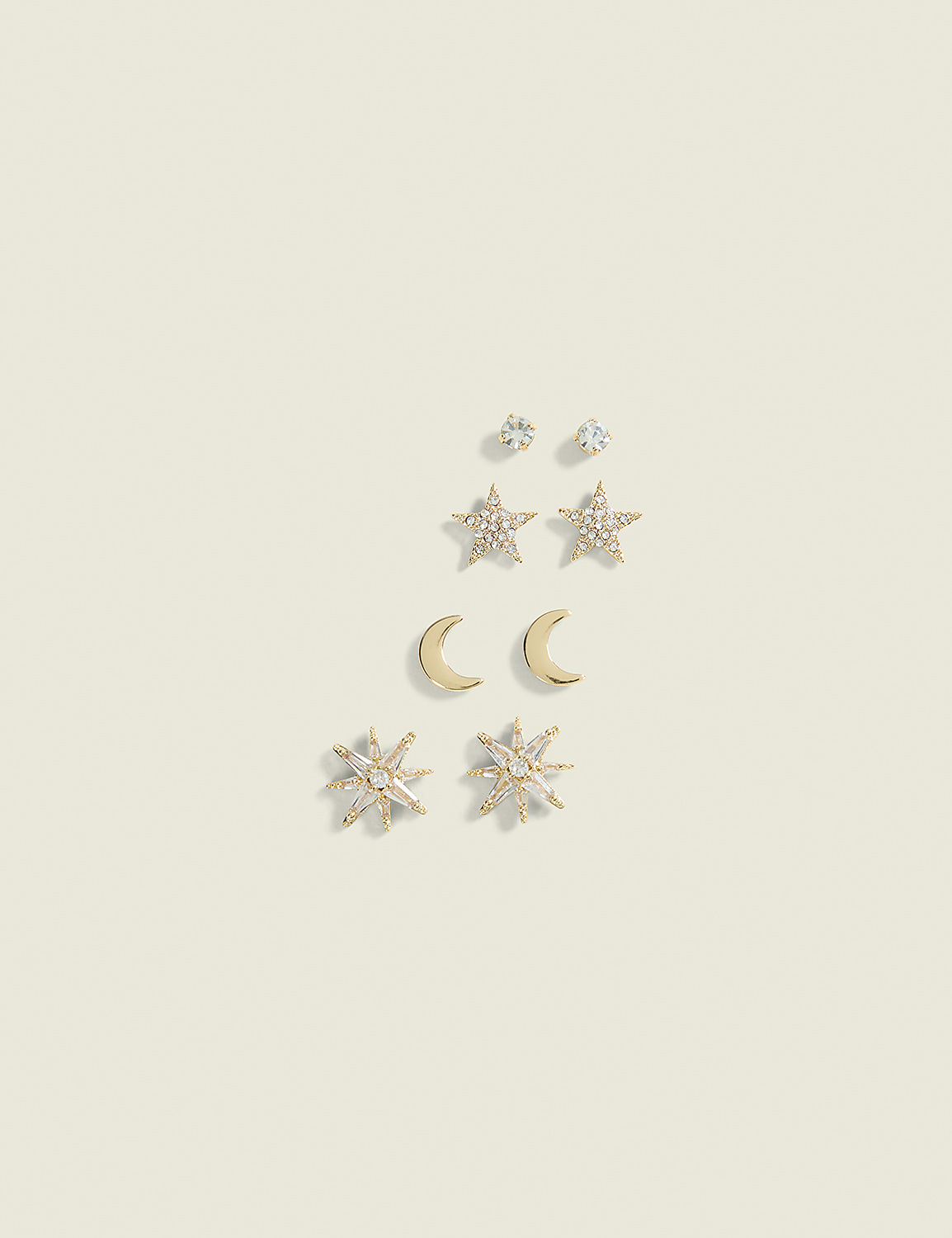 A collection of celestial-themed earrings, including stars, moons, and sparkling studs, are arranged on a plain, light-colored background. Product Image 1