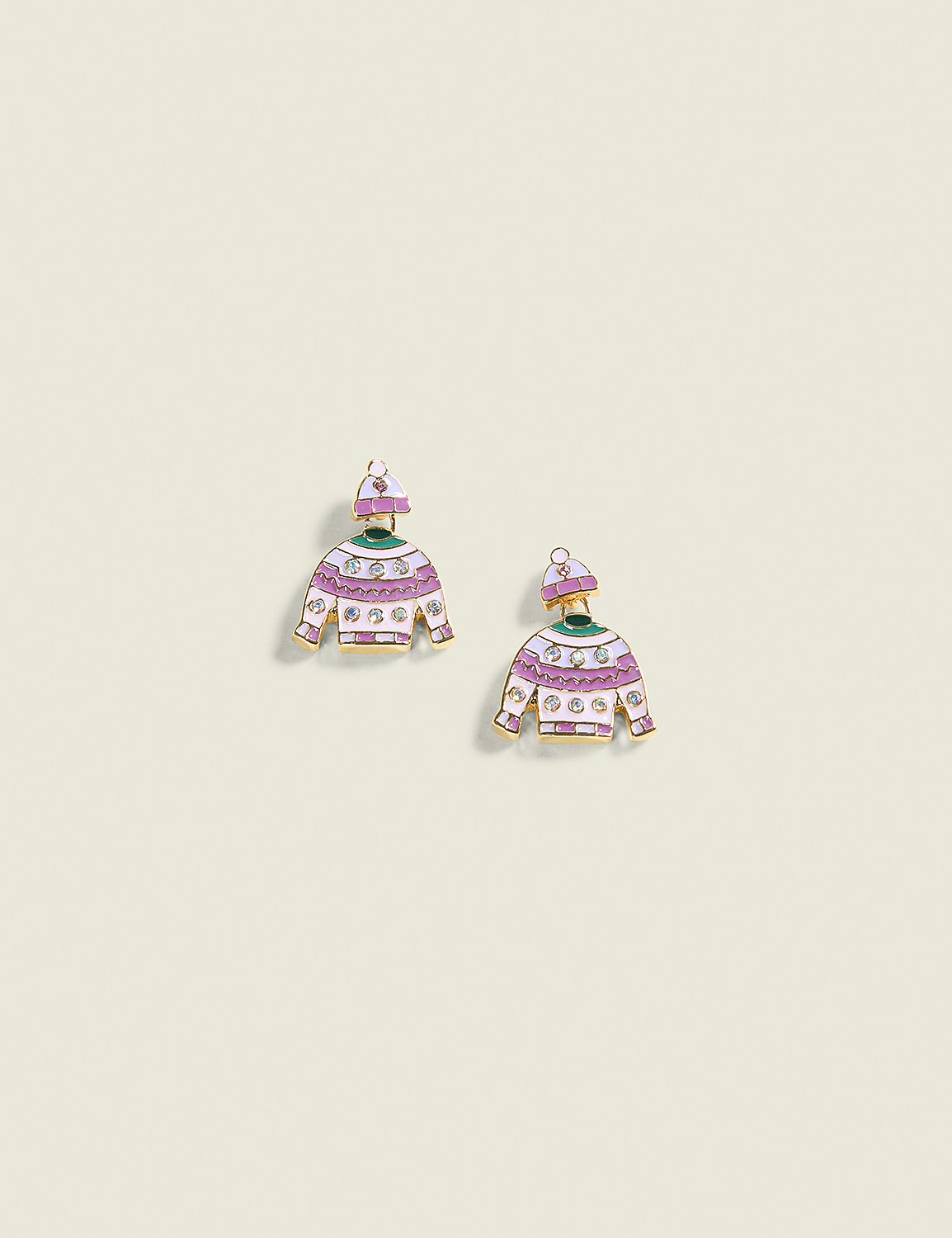 Two whimsical sweater-shaped earrings with purple and white stripes and a green collar are displayed against a plain, light cream background. Product Image 1