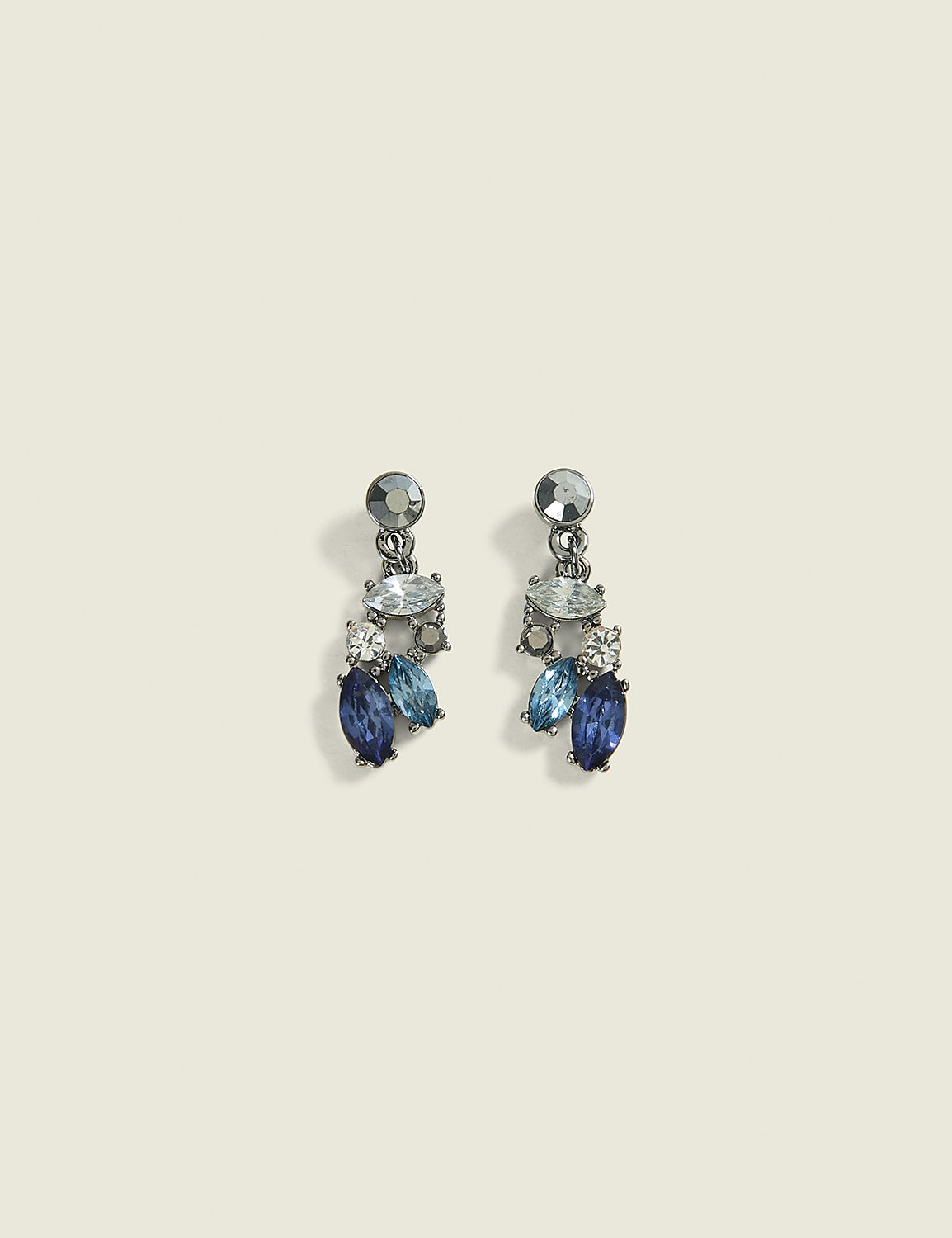 A pair of dangling earrings with blue and clear crystals are set against a plain, light-colored background. Product Image 1