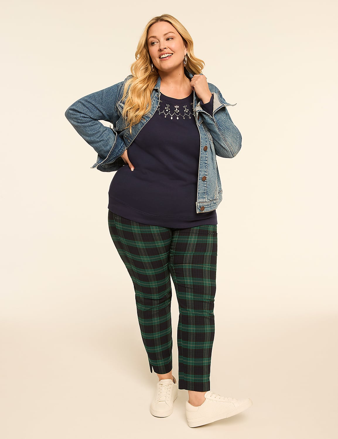 A woman in a denim jacket, navy shirt, and plaid pants poses against a plain, light-colored background. Product Image 3