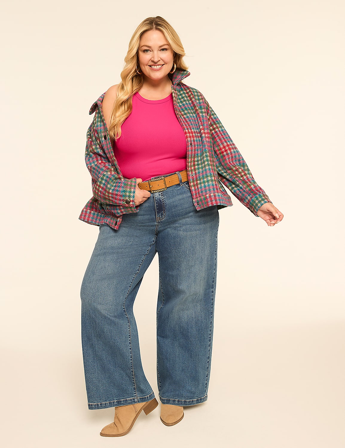 A smiling woman in a pink top, plaid jacket, and wide-leg jeans stands against a plain, light-colored background. Product Image 3