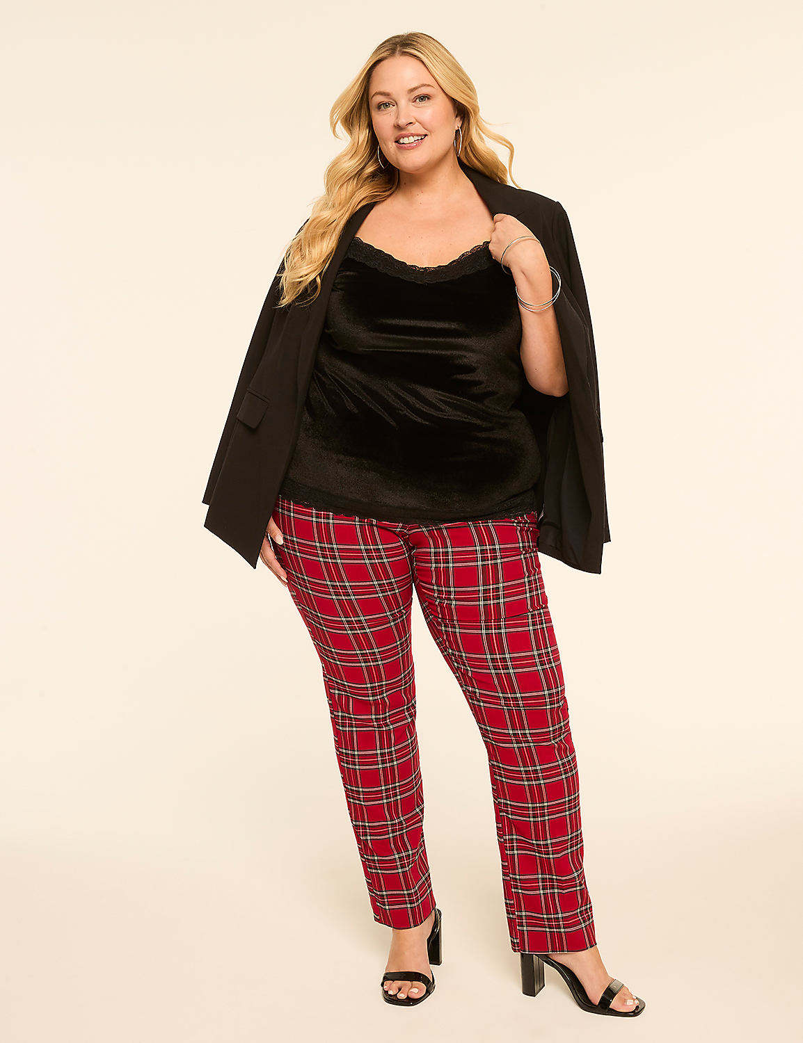A woman in a black velvet top, black blazer, and red plaid pants stands against a plain, light-colored background. Product Image 3