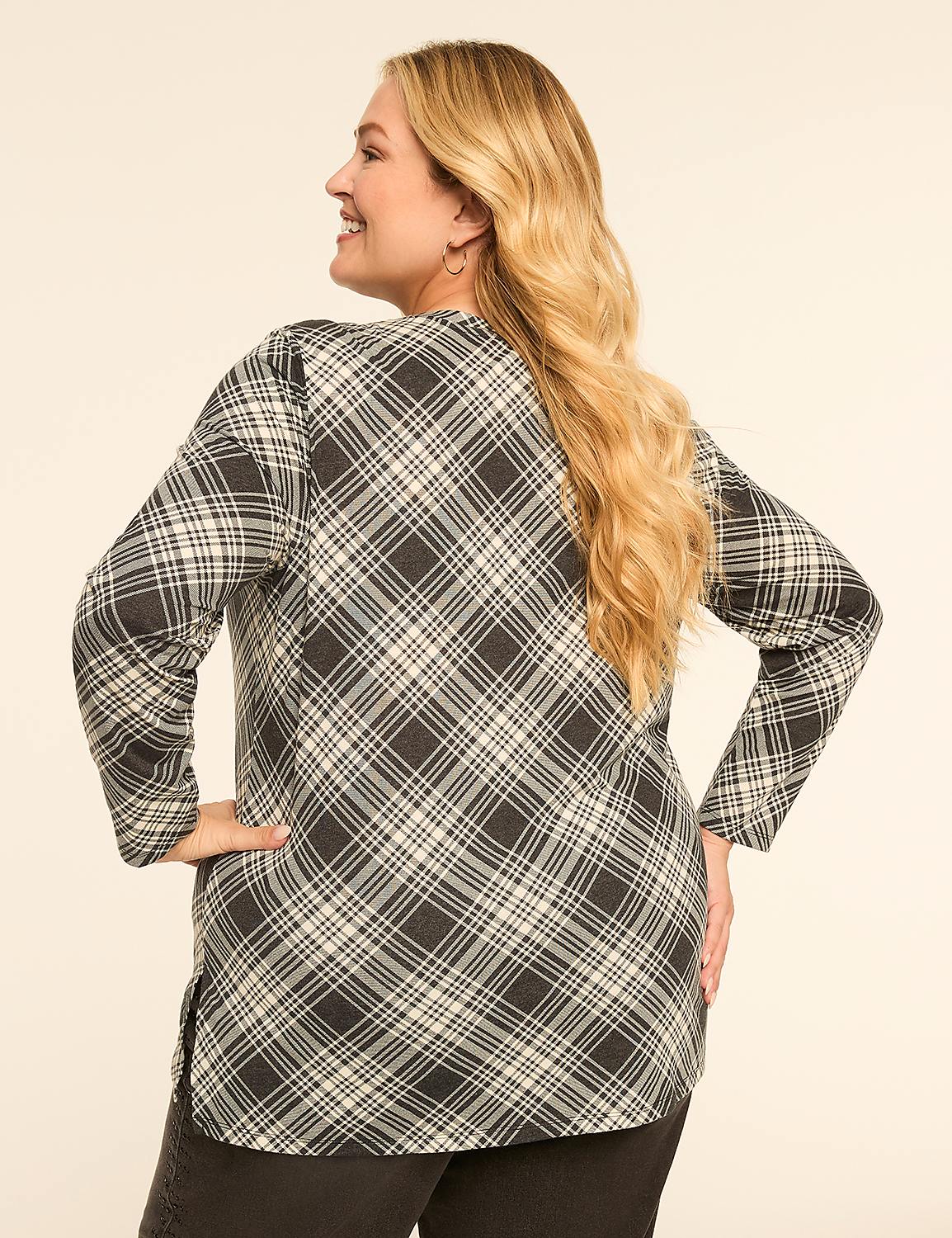 A woman with blonde hair wearing a plaid shirt stands with her back to the camera against a plain, light-colored background. Product Image 2