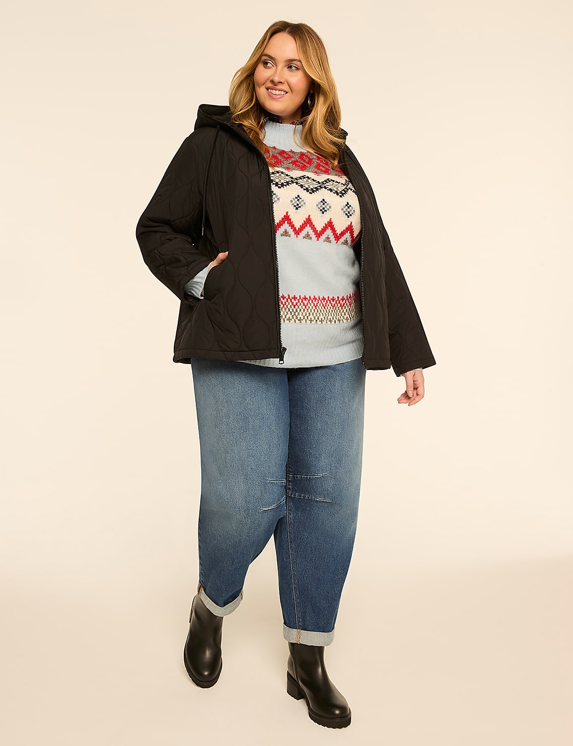 A woman in a quilted jacket, patterned sweater, and cuffed jeans stands against a plain, light-colored background. Product Image 3