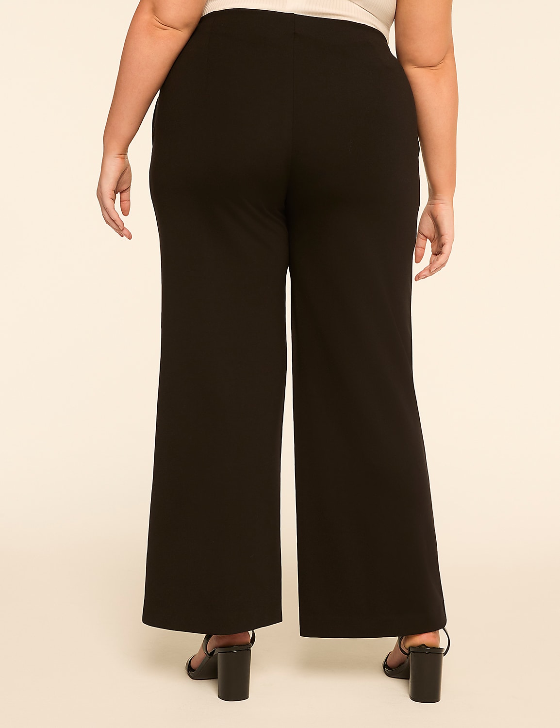 A person wearing black wide-leg pants and black heels stands against a plain, light-colored background. Product Image 2