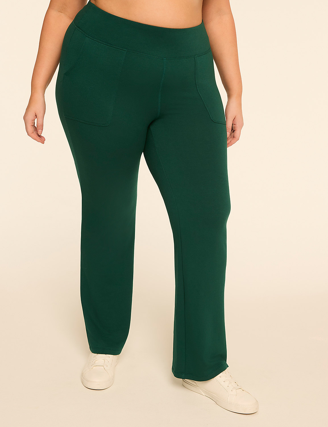 A person wearing green sweatpants and white sneakers stands against a plain, light-colored background. Product Image 1