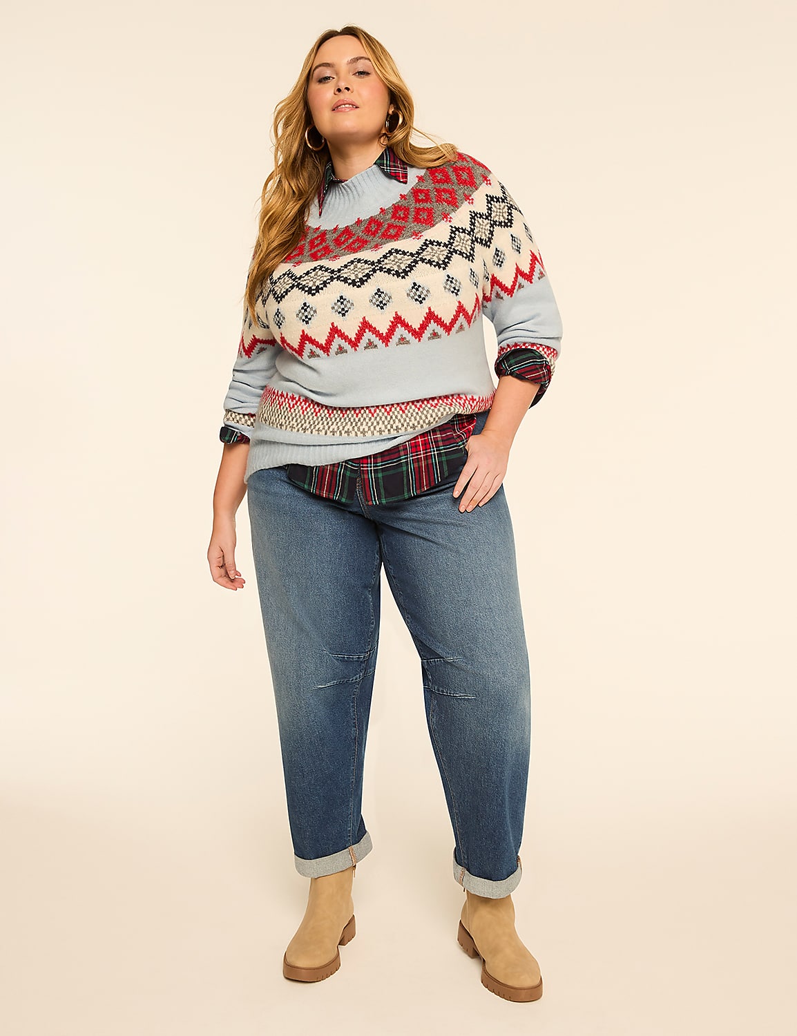 A woman in a patterned sweater and jeans stands against a plain, light background. Product Image 3