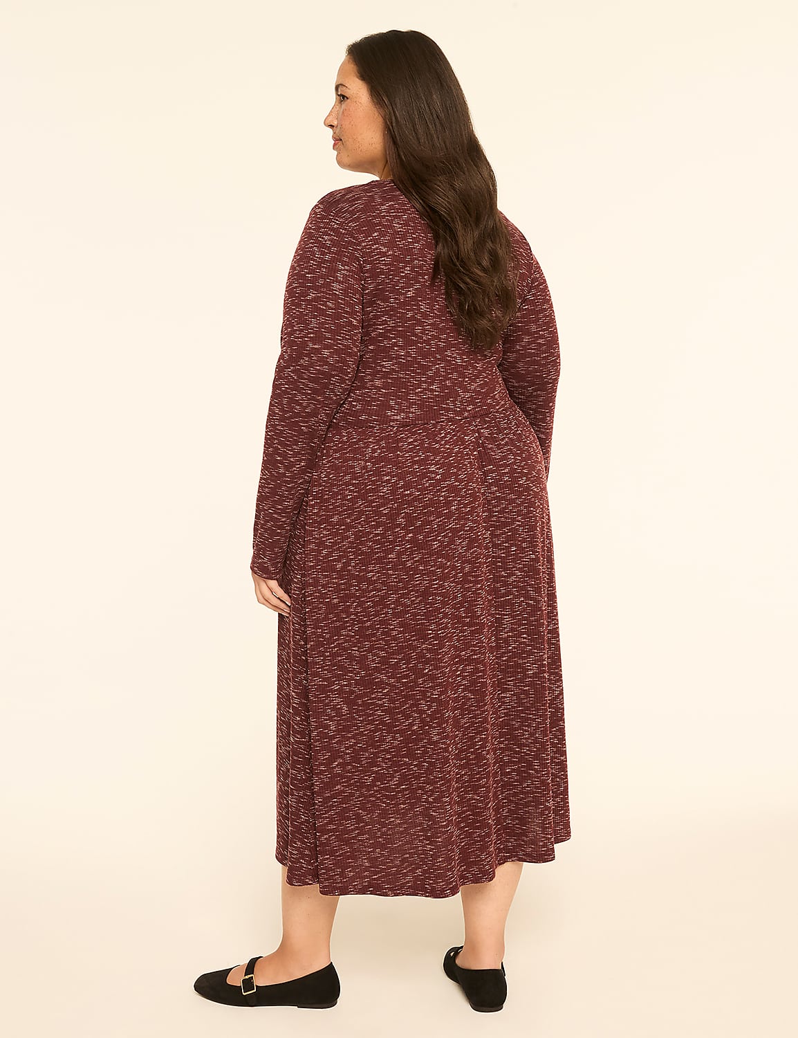 A woman in a maroon speckled dress stands against a plain, light-colored background. Product Image 2