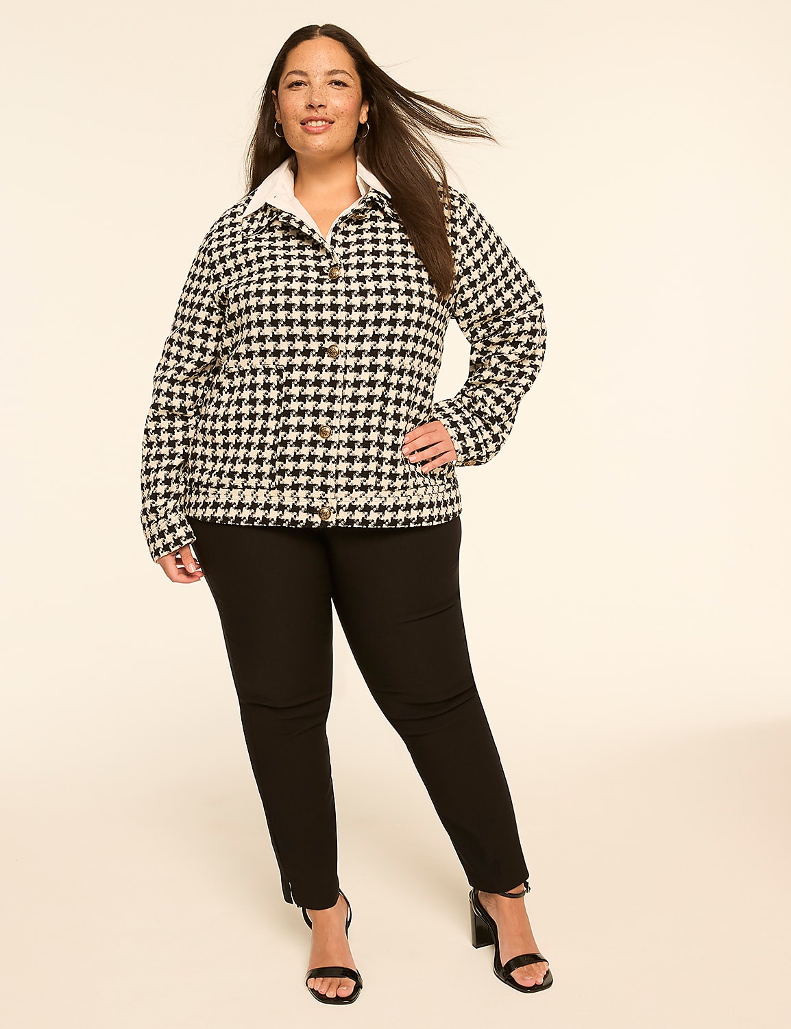 A woman in a houndstooth jacket and black pants stands against a plain, light-colored background. Product Image 3